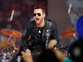 Country music singer Eric Church performs at halftime during a Washington Redskins and Dallas Cowboys game in Arlington, Texas Nov. 24, 2016. (AP Photo/Ron Jenkins)