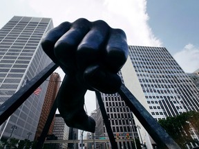 The Detroit skyline rises behind the monument to boxer Joe Louis, also known as "The Fist” in this file photo from 2013. The sculpture is an icon in Detroit’s downtown, and to the city itself, which earlier this year was named as No. 9 on a New York Times recommended list of 52 global destinations to visit in 2017. File photo/Associated Press