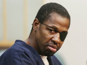 Accused murderer Markeith Loyd looks toward family members during court proceedings where he passed a two-page letter to the judge and said he didn't want to speak with him further at his arraignment on charges that can carry the death penalty Wednesday, Feb. 22, 2017, in Orlando, Fla. Loyd, suspected in the killing of his pregnant ex-girlfriend and an Orlando police officer, has been indicted on two counts of first-degree murder. (Red Huber /Orlando Sentinel via AP)