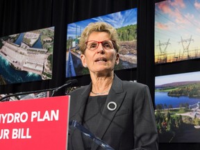 Ontario Premier Kathleen Wynne speaks during a press conference in Toronto in this file photo. The Liberal government unveiled a plan to cut hydro bills, the biggest political issue it faces a year away from an election.