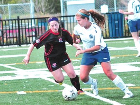 Sudbury Canadians' Cloe Lacasse, right, battles a North Mississauga Panthers player during Ontario Women's Soccer League under-21 action at James Jerome Sports Complex in 2012. Lacasse was one of many elite local players to suit up for the Canadians. File photo