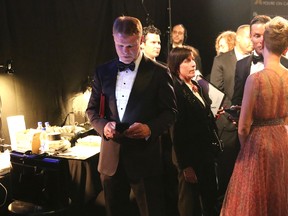 PricewaterhouseCoopers accountant Brian Cullinan, left, appears backstage using his cellular phone at the Oscars on Sunday, Feb. 26, 2017, at the Dolby Theatre in Los Angeles. (Photo by Matt Sayles/Invision/AP)