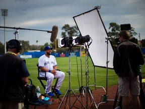 Toronto Blue Jays' Kendrys Morales does a TV interview during photo day at spring training in Dunedin on Feb. 21, 2017. (THE CANADIAN PRESS/Nathan Denette)