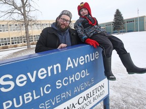 David Newell-Turner and his son Logan, who attends Severn Avenue PS. Severn isn't closing, but all the students are being transferred out next year when it transforms into a French immersion school.