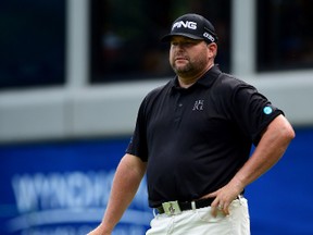 Jason Gore waits on the 18th green during the third round of the Wyndham Championship at Sedgefield Country Club on Aug. 22, 2015 in Greensboro, North Carolina. (Jared C. Tilton/Getty Images)