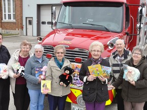 West Perth Fire Department Captain Mike Montgomery (left) and firefighter Cody Feltz accepted a generous donation of new teddy bears, books and toys from the Gould’s WI recently. Making the presentation were Marion McKay, Marg French, Jean Morris, Renata Rose, Hollie Archer and Marlene Archer. ANDY BADER/MITCHELL ADVOCATE