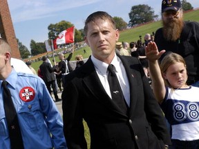 Aryan Nation member Charles Juba (C) along with other members participates in an American Nazi Party rally at Valley Forge National Park September 25, 2004 in Valley Forge, Pennsylvania. Hundreds of American Nazis from around the country were expected to attend. (Photo by William Thomas Cain/Getty Images)