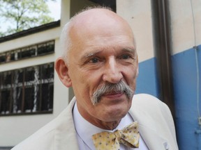 In this May 25, 2014 file photo, Janusz Korwin-Mikke, leader of a small far right and eurosceptic party leaves a polling station after voting in the European Parliament elections near Warsaw, Poland. (AP Photo/Alik Keplicz)