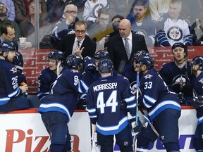 Jets head coach Paul Maurice talks to his team during a time out called by the St. Louis Blues in the third period on March 3, 2017. (JOHN WOODS/The Canadian Press)