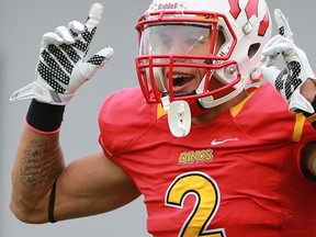 U of C Dino's Rashaun Simonise celebrates after scoring a touchdown against the U of S Huskies at McMahon Stadium in Calgary, on Oct. 3, 2015. (Crystal Schick/Postmedia File Photo)