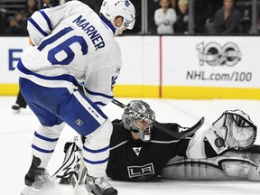 Los Angeles Kings goalie Jonathan Quick, right, stops a shot by Toronto Maple Leafs center Mitchell Marner during an overtime shootout in a NHL hockey game, Thursday, March 2, 2017, in Los Angeles. The Kings won 3-2 in an overtime shootout. (AP Photo/Mark J. Terrill)