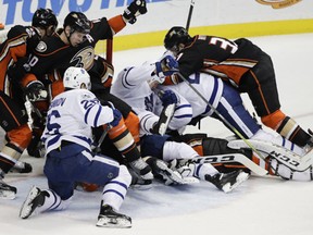 Players are tangled up around the net during the third period of an NHL hockey game between the Anaheim Ducks and the Toronto Maple Leafs on Friday, March 3, 2017, in Anaheim, Calif. The Ducks won 5-2. (AP Photo/Jae C. Hong)
