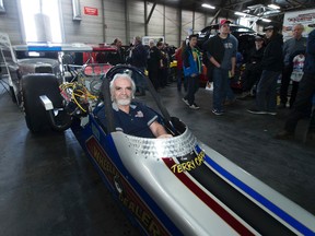 Canadian Motorsports Hall of Famer Terry Capp hands over the keys to the iconic 1975 top fuel dragster known as Wheeler Dealer to Wetaskiwin-Camrose MLA Bruce Hinkley at the World of Wheels Edmonton event on Saturday March 4, 2017 in Edmonton.  Capp was the former owner and operator of the vehicle and is handing over the keys on behalf of the current owner, Dr. Brian Friesen, to the Alberta Government to place in there collection at the Reynolds-Alberta Museum. Greg  Southam / Postmedia