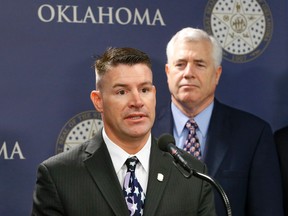 In this Friday, April 12, 2013 file photo, Oklahoma state Rep. John Bennett, R-Salisaw, speaks during a news conference in Oklahoma City. Bennett, who once likened Islam to a cancer, has handed out a form asking Muslims to answer questions that include, "Do you beat your wife?" (AP Photo/Sue Ogrocki, File)