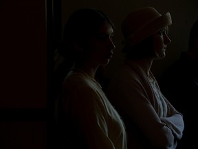 (left to right) Dressed in 1920's period costume Eliana Parade and Lauren Peters watch a $165 million expansion press conference announcement for Fort Edmonton Park, at the Hotel Selkirk in Edmonton Friday, March 3, 2017. The two are employees of the park. The project will focus on an expansion of the Indigenous Peoples Experience, the 1920's midway, and park entrance. Photo by David Bloom