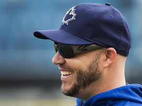 Toronto Blue Jays infielder/outfielder Steve Pearce laughs after batting practice during baseball spring training in Dunedin, Fla., on Thursday, February 23, 2017. (THE CANADIAN PRESS/Nathan Denette)