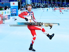 Canada's Alex Harvey celebrates after winning the men's cross-country 50 km freestyle mass start skiing competition in the FIS Nordic World Ski Championships in Lahti, Finland, on March 5, 2017.  (JONATHAN NACKSTRAND/AFP/Getty Images)