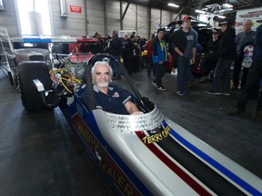 Canadian Motorsports Hall of Famer Terry Capp hands over the keys to the iconic 1975 top fuel dragster known as Wheeler Dealer to Wetaskiwin-Camrose MLA Bruce Hinkley at the World of Wheels Edmonton event on Saturday March 4, 2017 in Edmonton. Capp was the former owner and operator of the vehicle and is handing over the keys on behalf of the current owner, Dr. Brian Friesen, to the Alberta Government to place in there collection at the Reynolds-Alberta Museum. Greg Southam / Postmedia