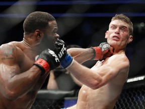 Tyron Woodley (left) hits Stephen Thompson in a welterweight championship bout at UFC 209 in Las Vegas on Saturday, March 4, 2017. (John Locher/AP Photo)