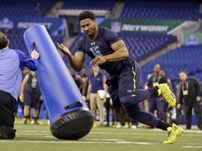 Texas A&M defensive end Myles Garrett runs a drill at the NFL football scouting combine in Indianapolis on Sunday. (Michael Conroy/AP Photo)