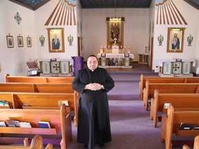 Father Vincenzo Fiore conducts latin mass at St. Michael's Ukrainian Catholic Church in Coniston. (John Lappa/Sudbury Star)