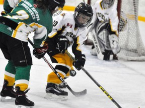 Jack Van Loon (10) of the Mitchell Atom LL team battles for the puck with Seaforth’s Jakob Potter during WOAA league playoff action last Thursday, March 2. The Meteors won 5-1. ANDY BADER/MITCHELL ADVOCATE