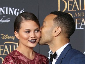Chrissy Teigen and John Legend attend the premiere of Disney's 'Beauty and the Beast' at the El Capitan Theater in Los Angeles, March 2, 2017. (FayesVision/WENN.COM)