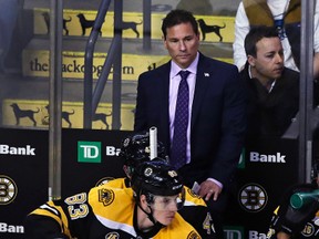 Boston Bruins interim coach Bruce Cassidy watches his players during an NHL game against the Arizona Coyotes in Boston on Feb. 28, 2017. (AP Photo/Charles Krupa)