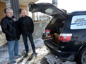 Bob Shaw, left, and Greg Thurston run London Automotive Keys, Fobs, and Remotes, a mobile business for lost modern car keys. (MORRIS LAMONT, The London Free Press)
