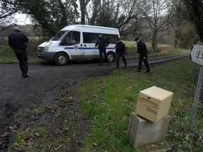 French police investigate the murder of  Pascal and Brigitte Troadec, both 49, their son Sebastien, 21, and daughter, Charlotte, 18.