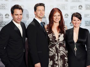In this Jan. 16, 2006, file photo, cast members from the comedy series "Will & Grace," from left, Eric McCormack, Sean Hayes, Debra Messing and Megan Mullally, pose backstage after making an award presentation at the 63rd Annual Golden Globe Awards in Beverly Hills, Calif. The stars of "Will & Grace" gave fans a behind the scenes glimpse at production of the series’ revival on the weekend of March 5, 2017. (AP Photo/Reed Saxon, File)