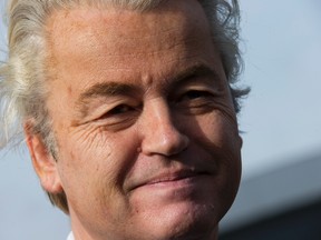 Firebrand anti Islam lawmaker Geert Wilders answers question from the media during an election campaign stop outside De Telegraaf newspaper buildings in Amsterdam Netherlands, Sunday, March 5, 2017. (AP Photo/Peter Dejong)