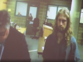Sheaen E. Smith (right) appeared in court Monday on second degree murder charges. Smith is accused of killing his mother, Aurora Buol-Smith on Sunday because he thought she was a vampire and he is a werewolf. (Screengrab)