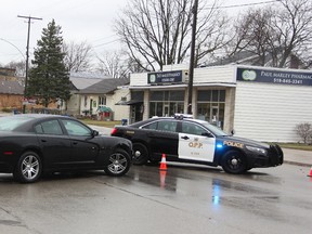 Lambton OPP block Broadway Street in Wyoming after an armed pharmacy robbery Tuesday morning. OPP and Sarnia police are investigating whether the robbery is linked to an attempted armed robbery at another pharmacy in Sarnia earlier in the day. (Tyler Kula/Sarnia Observer)