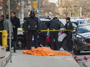 Toronto Police officers are pictured at the scene of a  recent homicide on George St. (ERNEST DOROSZUK,  Toronto Sun)