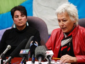 Angie Hutchinson (left), Ka Ni Kanichihk, Family Support Coordinator and Missing and Murdered Indigenous Women and Girls (MMIWG) Coalition member, listens in as Sandra Delaronde, Executive Director of the Indigenous Women's Research Institute, MMIWG Coalition co-chair expresses her concerns about the national inquiry into murdered and missing indigenous women and girls in Winnipeg, Tuesday, March 7, 2017. (THE CANADIAN PRESS/John Woods)