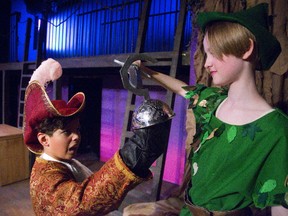 Jordan Classen, 12, plays Captain Hook and Evelyn Webb is Peter Pan in the Original Kids Theatre Company?s production of Journey to Neverland. (MIKE HENSEN, The London Free Press)
