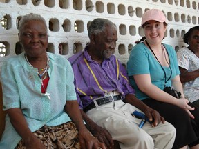 Holy Cross Catholic Secondary School Grade 12 student Meredith DeMarsh sits with a few of the residents at St. Monica’s Home for the Abandoned Elderly during the Holy Cross mission trip to Jamaica at the end of February. (Photo courtesy of Algonquin and Lakeshore Catholic District School Board)