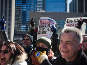 People gather during a demonstration regarding motion M-103 at Toronto City Hall on Saturday, March 4, 2017. THE CANADIAN PRESS/Christopher Katsarov