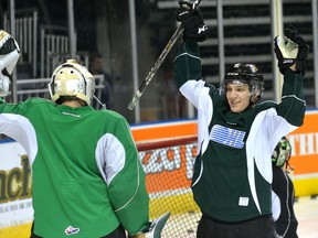 London Knights forward Robert Thomas celebrates a goal with goaltender Tyler Johnson in practice at Budweiser Gardens on Tuesday. (MORRIS LAMONT, The London Free Press)
