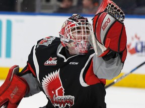 Moose Jaw Warriors goaltender Zach Sawchenko reaches for a flying puck against the Edmonton Oil Kings at Rogers Place in Edmonton on Sunday, Jan. 22, 2017. (Ian Kucerak)