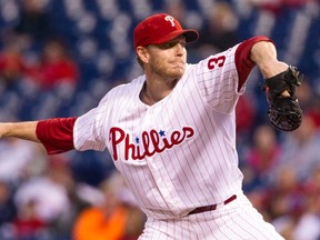 Philadelphia Phillies starting pitcher Roy Halladay delivers against the Miami Marlins during the first inning of a baseball game in Philadelphia on Sept. 17, 2013. (THE CANADIAN PRESS/AP, Chris Szagola)