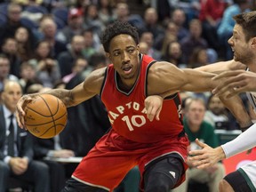 Toronto Raptors' DeMar DeRozan drives against Milwaukee Bucks' Matthew Dellavedova during an NBA game on March 4, 2017. (AP Photo/Tom Lynn)