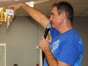 Water Wells First spokesperson Kevin Jakubec holds a sediment trapper that is recommended for landowners to install on their water wells if they are located within the North Kent 1 wind farm project area. He gave an update on the situation during a public meeting in at Country View Golf Course north of Chatham, Ont. on Tuesday March 7, 2017. (Ellwood Shreve/Chatham Daily News)