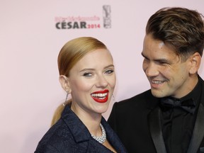 In this Feb. 28, 2014, file photo, U.S. actress Scarlett Johansson, left, and her partner Romain Dauriac arrive at the 39th French Cesar Awards Ceremony, in Paris. Dauriac's lawyer confirmed to The Associated Press that Johansson filed for divorce from Dauriac on March 7, 2017, in New York,. (AP Photo/Lionel Cironneau, File)