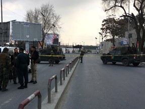 Security forces block the main road to a military hospital in Kabul, Afghanistan, Wednesday, March 8, 2017. Gunmen stormed the military hospital Wednesday in a neighbourhood in the Afghan capital that is also home to a number of embassies. (AP Photo/Massoud Hossaini)