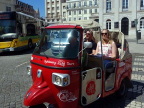Little tuk-tuks are a fun way to sightsee around Lisbon. (photo: Rick Steves)