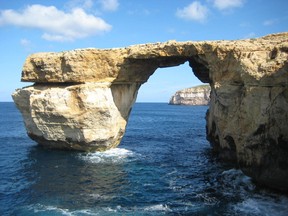 This is a April 2014 image of the landmark the Azure Window located just off Malta. The natural rock arch jutting off the Maltese island of Gozo, has collapsed into the sea during a storm. Malta’s prime minister called the loss on Wednesday March 8, 2017, of the iconic limestone formation “heartbreaking.” No one was injured by the fallen arch, which was also a TV and film backdrop.(Caroline Hodgson via AP)
