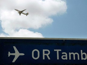 In this Oct. 2006 file photo a plane takes off from Johannesburg’s OR Tambo International Airport. (AP Photo/Mujahid Safodien)