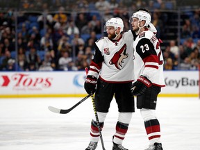 Alex Goligoski of the Arizona Coyotes celebrates his goal against the Buffalo Sabres with Oliver Ekman-Larsson during an NHL game on March 2, 2017. (Photo by Kevin Hoffman/Getty Images)